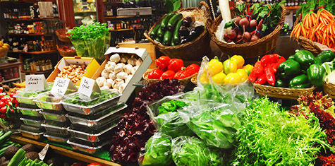 Baskets and shelves full of produce and grocery items