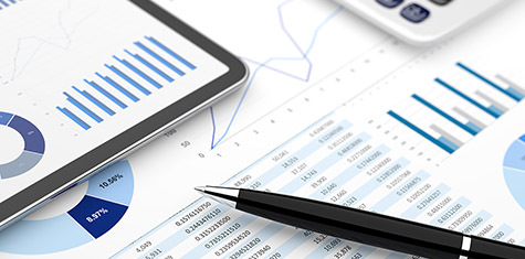 Array of tax planning documents, pen, and calculator