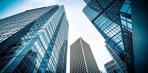 Ground view looking up at a group of skyscrapers